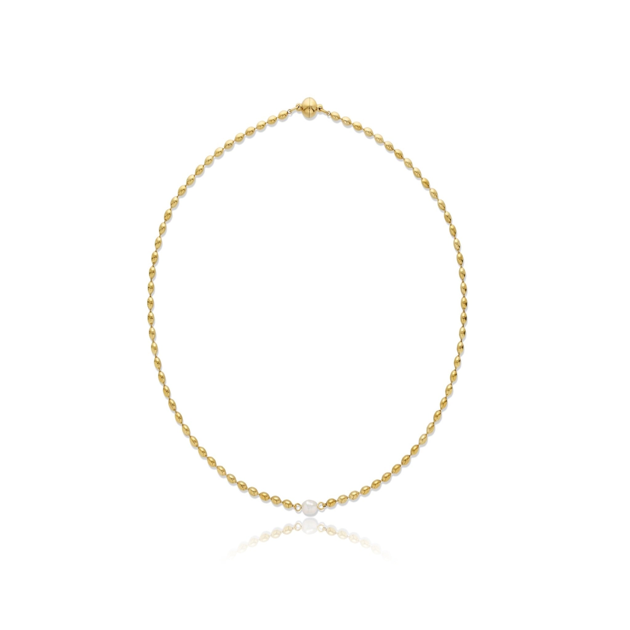 Gold necklace with a single pearl on a white background