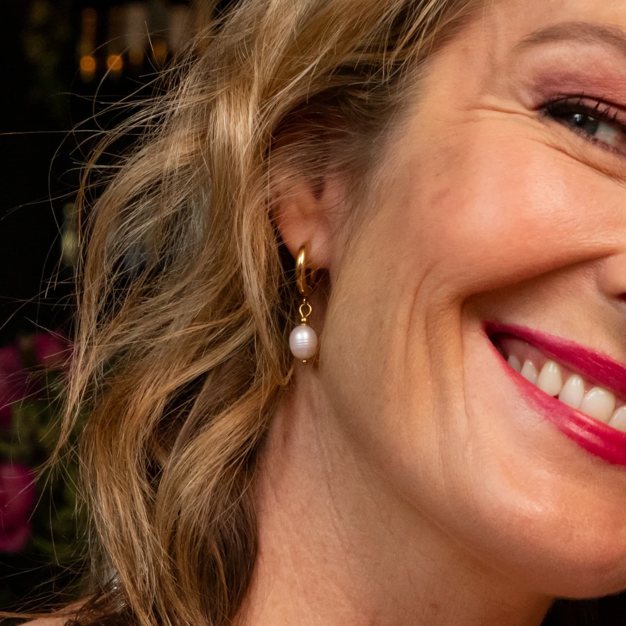 Woman wearing The Classique freshwater pearl hoop earrings by Avean Jewellery