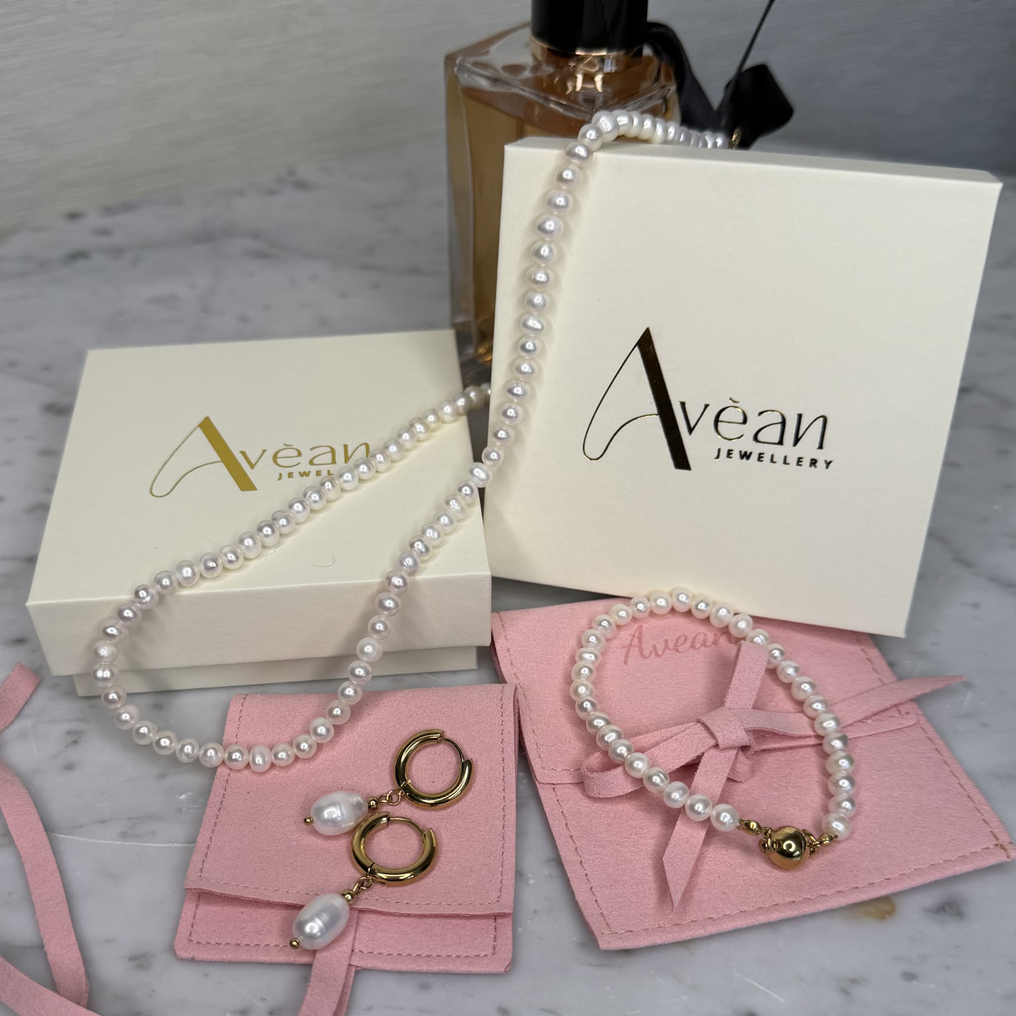 Freshwater pearl hoop earrings on Avean Jewellery packaging.